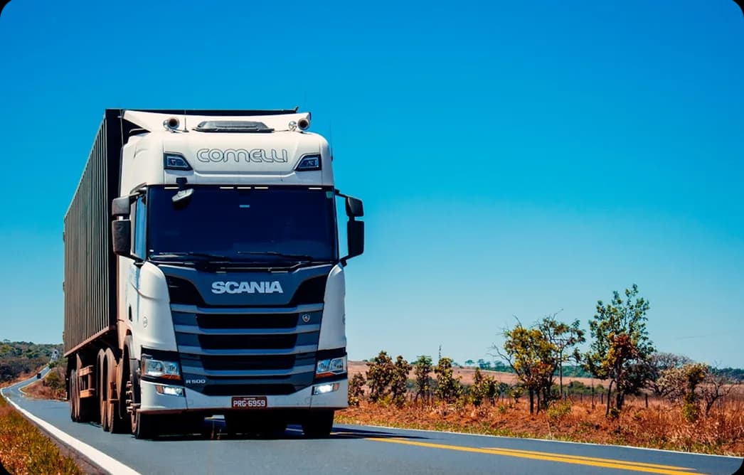 A long-haul truck running a freight route on an open highway